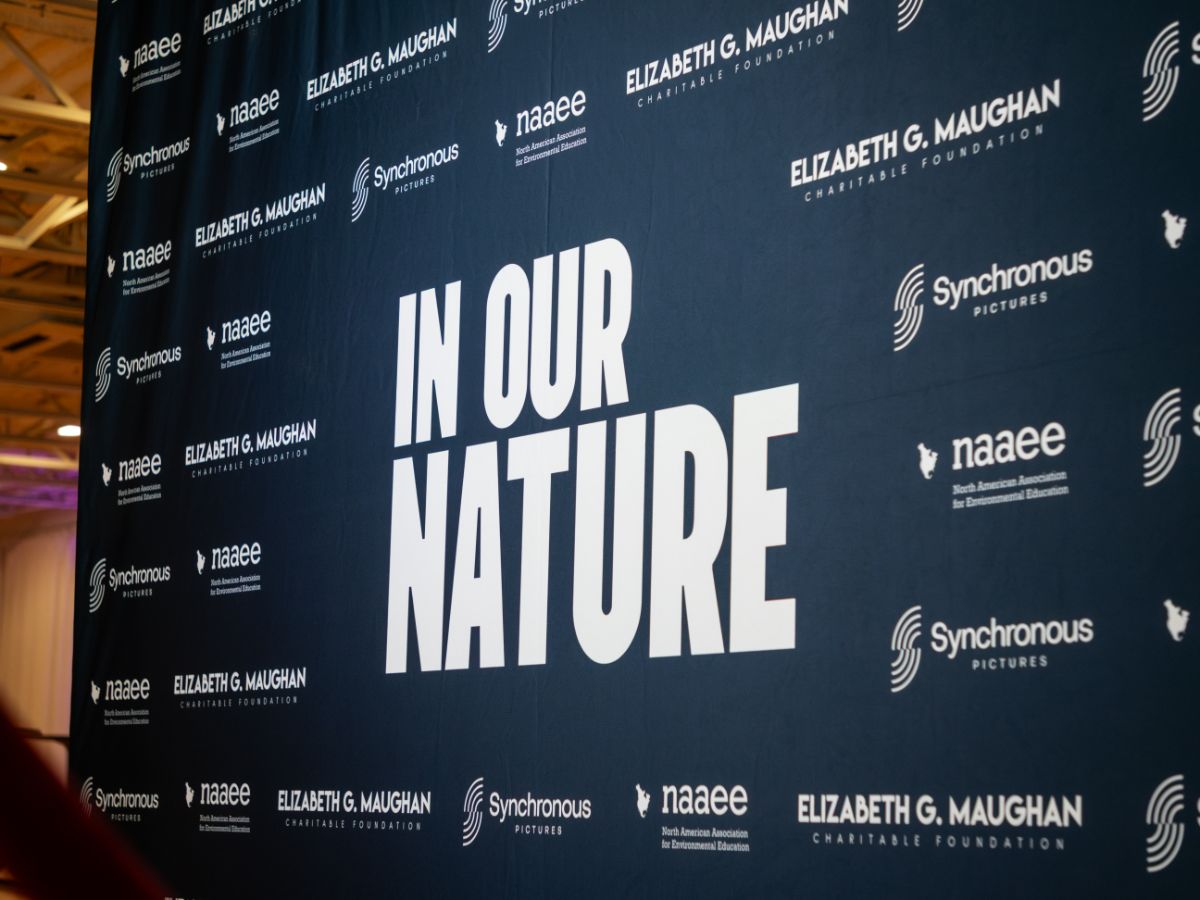 In Our Nature step-and-repeat banner