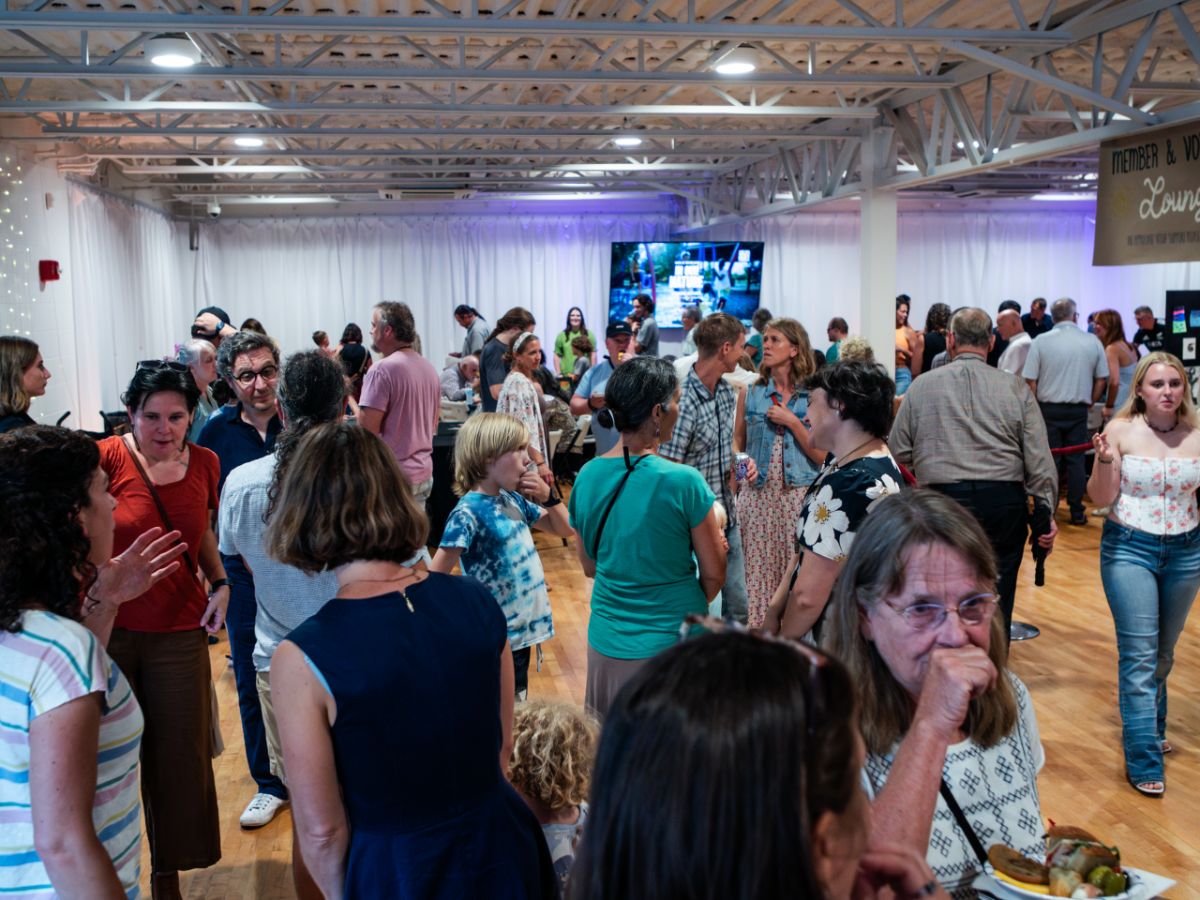 Guests gathering at a screening reception