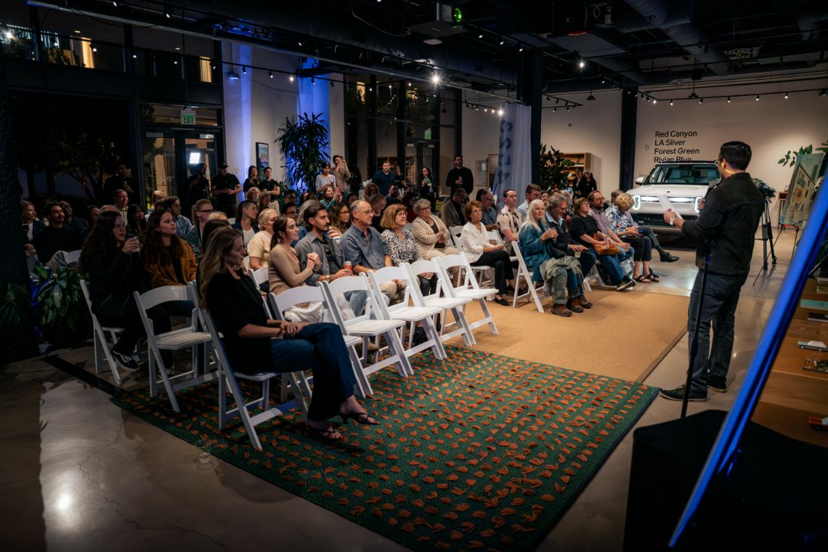 Screening venue with seating and a Rivian vehicle